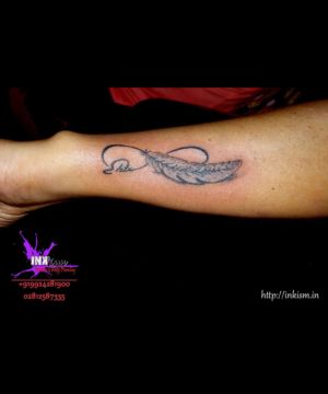 Infinity with feather tattoo, Infinity tattoo, Feather Tattoo, Calligraphy name Tattoo, Name Tattoo, Inkism tattoo and body piercing rajkot gujarat